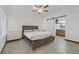 Bedroom with wood-look floors, ceiling fan, and ensuite bathroom with barn door at 9000 Las Vegas Blvd # 1004, Las Vegas, NV 89123