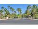 An entrance with tall palm trees lining the street to a gated community at 9000 Las Vegas Blvd # 1004, Las Vegas, NV 89123