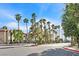 Inviting apartment complex entrance with palm trees and well-manicured landscaping at 9000 Las Vegas Blvd # 1004, Las Vegas, NV 89123
