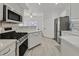 Well-lit kitchen with stainless steel appliances, white cabinets and countertops, and gas range at 9000 Las Vegas Blvd # 1004, Las Vegas, NV 89123