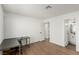 Bright bedroom with wood floors, white walls, and an adjacent bathroom at 905 Sulphur Springs Ln # 101, Las Vegas, NV 89128