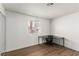 Well-lit bedroom with wood-look floors and a window offering natural light at 905 Sulphur Springs Ln # 101, Las Vegas, NV 89128
