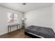 Bedroom with a window and a simple desk setup providing a bright space at 905 Sulphur Springs Ln # 101, Las Vegas, NV 89128