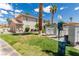 Well-maintained condo exteriors with mailboxes and dog waste station on a lush green lawn at 905 Sulphur Springs Ln # 101, Las Vegas, NV 89128
