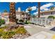 Exterior condo view with mailboxes, lush landscaping, and sidewalks at 905 Sulphur Springs Ln # 101, Las Vegas, NV 89128