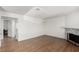 Spacious living room featuring hardwood flooring and fireplace at 905 Sulphur Springs Ln # 101, Las Vegas, NV 89128