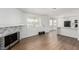 Open floor plan with modern fireplace and hardwood flooring at 905 Sulphur Springs Ln # 101, Las Vegas, NV 89128