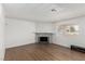 Bright living room with tile fireplace and natural light at 905 Sulphur Springs Ln # 101, Las Vegas, NV 89128