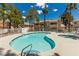 Beautiful community pool and hot tub with palm trees and lounge chairs for relaxing in the sun at 905 Sulphur Springs Ln # 101, Las Vegas, NV 89128