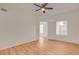 Empty bedroom featuring hardwood floors, ceiling fan and large window at 9303 Gilcrease Ave # 1245, Las Vegas, NV 89149