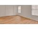 Bedroom featuring wood floors, large closet, and bright windows at 9303 Gilcrease Ave # 1245, Las Vegas, NV 89149