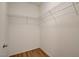 Walk-in closet with wood floor and wire shelving for easy storage at 9303 Gilcrease Ave # 1245, Las Vegas, NV 89149