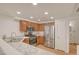 Cozy kitchen features stainless steel appliances and wood cabinets at 9303 Gilcrease Ave # 1245, Las Vegas, NV 89149