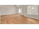Bright living room with wood floors, ceiling fan, and a large window at 9303 Gilcrease Ave # 1245, Las Vegas, NV 89149