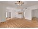 Open-concept living area with wood floors, connecting to a kitchen at 9303 Gilcrease Ave # 1245, Las Vegas, NV 89149