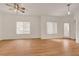 Bright living room with wood floors, large windows, and modern lighting at 9303 Gilcrease Ave # 1245, Las Vegas, NV 89149