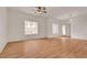 Spacious living room with wood floors, large windows, and ceiling fan at 9303 Gilcrease Ave # 1245, Las Vegas, NV 89149