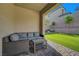 Covered outdoor patio with comfortable seating, perfect for relaxation and outdoor entertaining at 10142 Skye Saddle Ave, Las Vegas, NV 89166