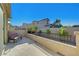 Outdoor seating area with wrought iron railing overlooking a landscaped yard at 10142 Skye Saddle Ave, Las Vegas, NV 89166