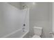 Clean bathroom featuring a tiled shower and bathtub, paired with a modern toilet at 10142 Skye Saddle Ave, Las Vegas, NV 89166