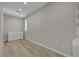 Bedroom with white cabinet, wood-look flooring and a window bringing in lots of natural light at 10142 Skye Saddle Ave, Las Vegas, NV 89166