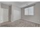 Bedroom with sliding closet doors, carpet, and natural light from a window at 10142 Skye Saddle Ave, Las Vegas, NV 89166