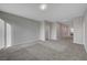 Spacious bonus room with neutral carpet and ample lighting, suitable for recreation or entertainment at 10142 Skye Saddle Ave, Las Vegas, NV 89166