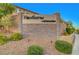 Elegant community entrance sign with stone detailing, manicured landscaping at 10142 Skye Saddle Ave, Las Vegas, NV 89166