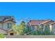 Beautiful home exterior with a tile roof and mountain views in the background at 10142 Skye Saddle Ave, Las Vegas, NV 89166