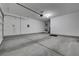 Spacious two-car garage with ample room for vehicles and storage, and overhead door at 10142 Skye Saddle Ave, Las Vegas, NV 89166