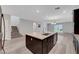Spacious kitchen featuring an island, stainless steel appliances, and an open floor plan at 10142 Skye Saddle Ave, Las Vegas, NV 89166