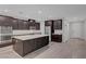 Bright kitchen featuring a large island, stainless steel appliances, and modern cabinetry at 10142 Skye Saddle Ave, Las Vegas, NV 89166