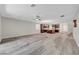 Open-concept living room and kitchen with lots of natural light and backyard access at 10142 Skye Saddle Ave, Las Vegas, NV 89166