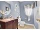 Cozy powder room with stylish vanity, mirror accents, and fresh decor at 10392 Smokemont Ct, Las Vegas, NV 89129