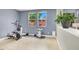 A versatile bonus room with tile flooring and natural light, ideal for a home gym at 10392 Smokemont Ct, Las Vegas, NV 89129