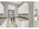 Butler pantry featuring granite counters, and glass storage at 10392 Smokemont Ct, Las Vegas, NV 89129