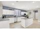 Bright kitchen features granite counters, stainless steel appliances, island, and ample cabinet space at 10392 Smokemont Ct, Las Vegas, NV 89129