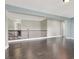 Open-concept living room boasting dark hardwood floors and neutral paint with a view of the second story at 10392 Smokemont Ct, Las Vegas, NV 89129