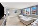 Spacious living room featuring multiple windows and comfortable seating at 10392 Smokemont Ct, Las Vegas, NV 89129
