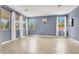 Bright living room filled with natural light, tile flooring, and neutral tones at 10392 Smokemont Ct, Las Vegas, NV 89129