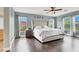 Serene main bedroom with hardwood floors, stylish decor, natural light, and 'LOVE' displayed on the wall at 10392 Smokemont Ct, Las Vegas, NV 89129