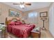 Bedroom featuring a ceiling fan, carpet flooring, and a dark-colored bed set at 107 Elm St, Henderson, NV 89015