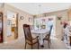 Bright dining room featuring a chandelier and backyard access through french doors at 107 Elm St, Henderson, NV 89015