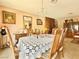 Elegant dining room featuring a chandelier, vintage decor, and a brick fireplace at 107 Elm St, Henderson, NV 89015