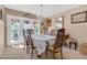 Bright dining room with a chandelier and a view of the backyard through glass doors at 107 Elm St, Henderson, NV 89015