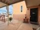 Charming front porch featuring wrought-iron accents and providing a welcoming entrance at 107 Elm St, Henderson, NV 89015
