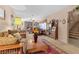 Inviting living room with a brick fireplace, plush seating, and a view of the staircase at 107 Elm St, Henderson, NV 89015