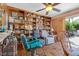 Cozy living room featuring built-in shelving, tile flooring, and comfortable seating at 107 Elm St, Henderson, NV 89015