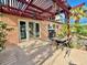 Spacious patio with a pergola providing shade over an outdoor dining area near the pool at 107 Elm St, Henderson, NV 89015
