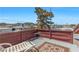 Rooftop deck space, enclosed by a wooden fence, offering neighborhood and mountain views at 107 Elm St, Henderson, NV 89015